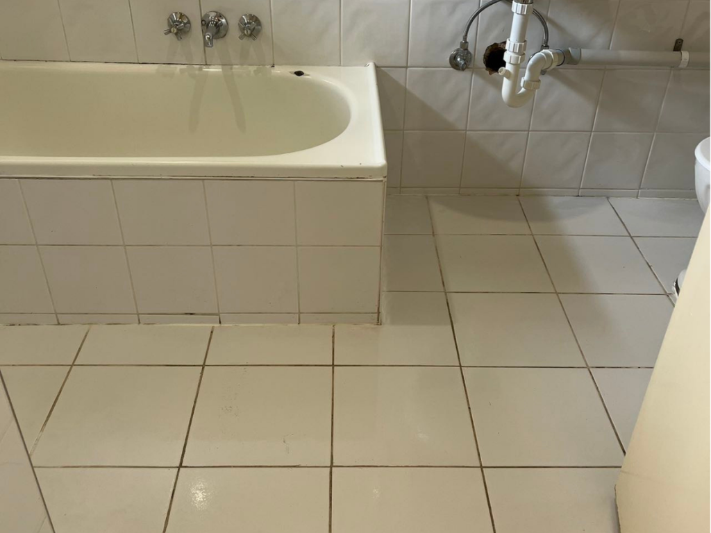 Pristine bathroom floor cleaned by O2O Cleaning during end of lease cleaning.